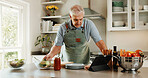 Tablet, search and senior man in kitchen with recipe tutorial, dinner method or online guide. Learning, instructions and old person in home with healthy ingredients, diet or steps in meal prep