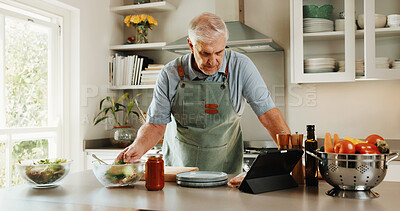Buy stock photo Tablet, recipe and senior man in kitchen with tutorial search, dinner method or online guide. Learning, instructions and old person in home with healthy ingredients, diet or steps in meal prep