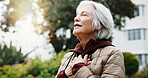 Old woman, breathing and meditation in nature for fitness, mindfulness and holistic balance for zen. Bokeh, senior person and eyes closed for inner peace, spiritual healing and fresh air for wellness