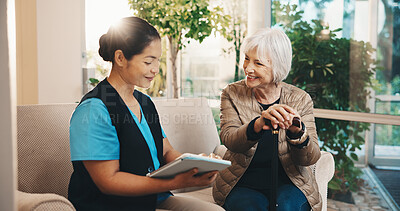 Buy stock photo Caregiver, tablet and old woman in nursing home with cane, wellness survey and smile for discussion. Flare, happy senior person and nurse on couch with tech, checkup questions and walking stick.