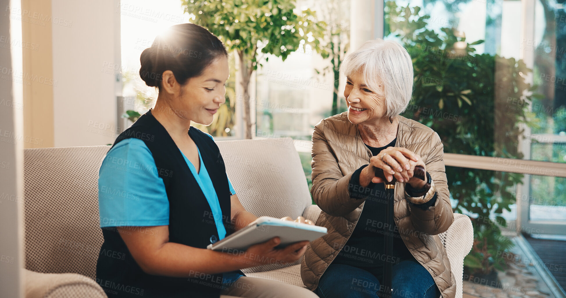 Buy stock photo Caregiver, tablet and old woman in nursing home with cane, wellness survey and smile for discussion. Flare, happy senior person and nurse on couch with tech, checkup questions and walking stick.