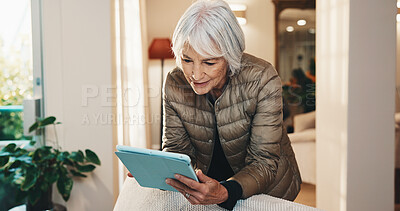 Buy stock photo Ebook, tablet or senior woman in retirement home with reading, online library or browse on storytelling app. Happy, blog or elderly person with tech, virtual scroll or literature on web platform.