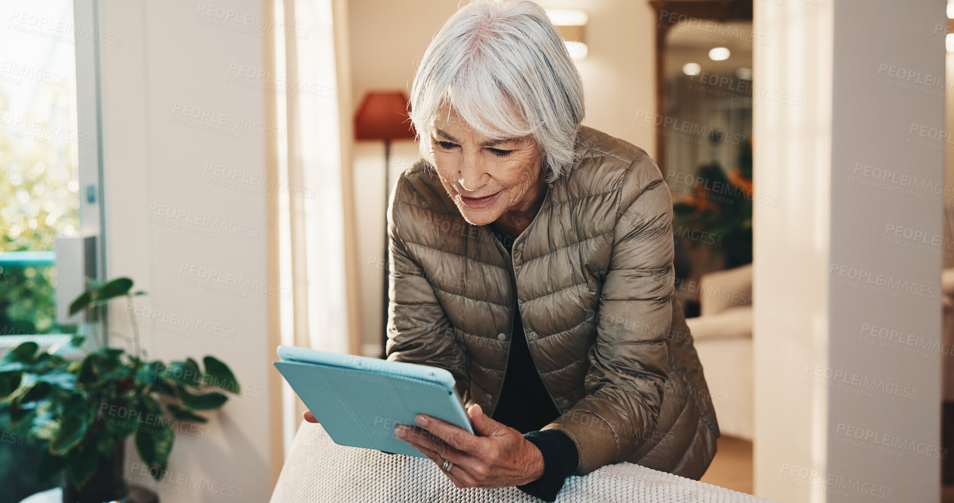 Buy stock photo Ebook, tablet or senior woman in retirement home with reading, online library or browse on storytelling app. Happy, blog or elderly person with tech, virtual scroll or literature on web platform.