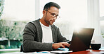 Remote work, man and research on laptop in home for financial reporting, source finding and taxes. Freelance, accountant and typing on tech in house for bookkeeping, data entry and payroll management