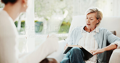 Buy stock photo Counseling, psychologist and woman in consultation, notebook or advice for mental health evaluation. Therapy session, patient or mature person writing notes for assessment, feedback or help in office