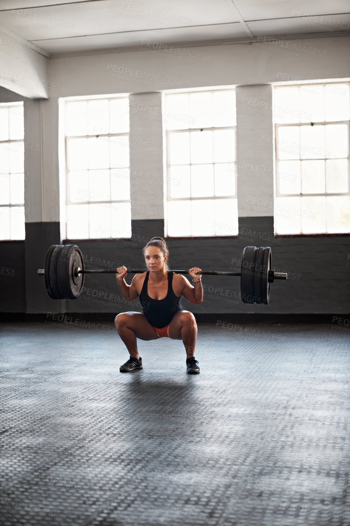 Buy stock photo Squat, woman and barbell in gym for exercise, strength benefits or muscle development. Fitness, female person and weight lifting for training, power workout or bodybuilder conditioning in health club