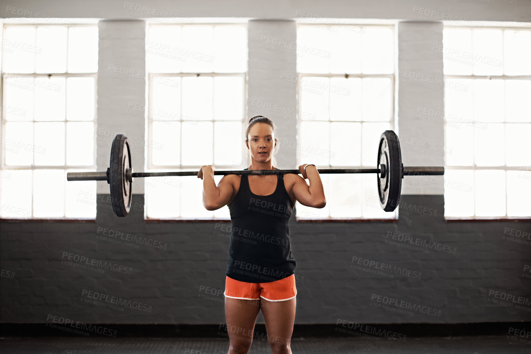 Buy stock photo Strong, woman and barbell in gym for exercise, strength benefits, power or muscle development. Fitness, female person or weightlifting for training, workout or bodybuilder conditioning in health club