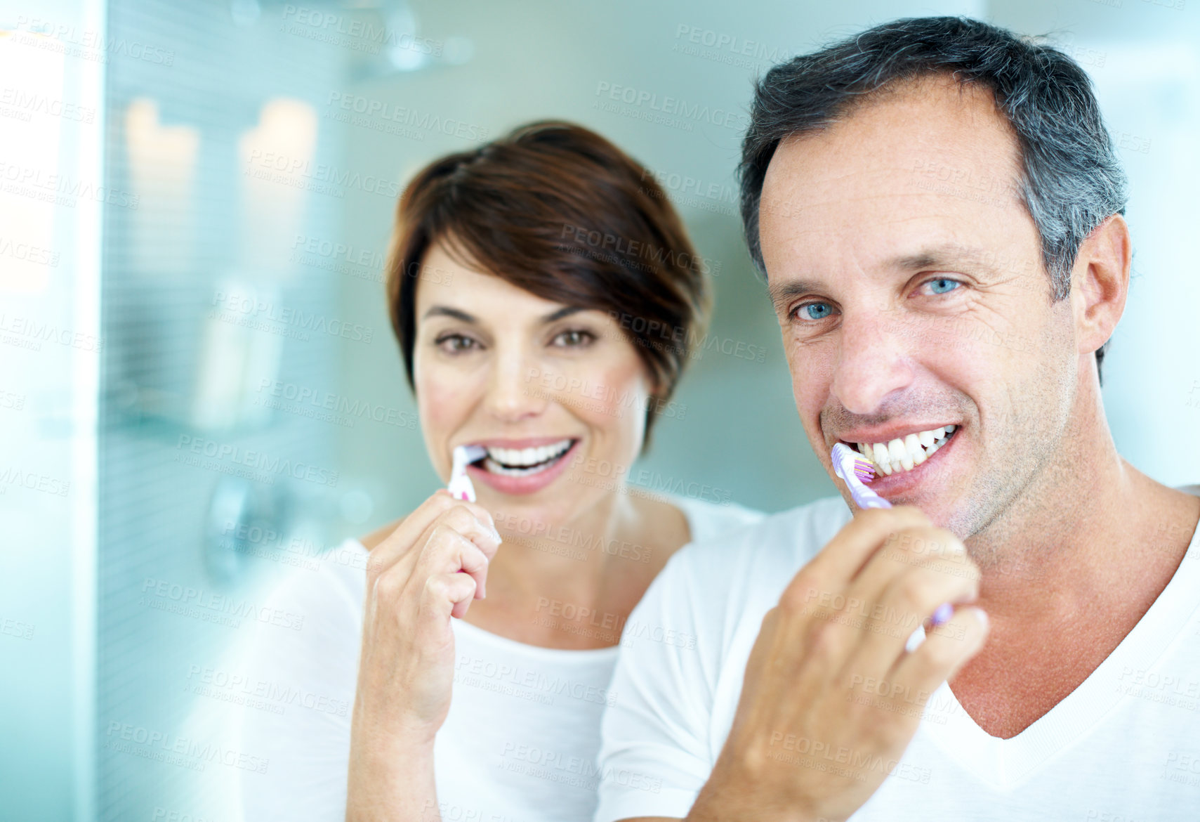 Buy stock photo Dental care, portrait and happy couple in bathroom, brushing teeth and grooming with partner in home. Mature people, smile and oral hygiene with toothbrush, morning routine or cleaning mouth in house
