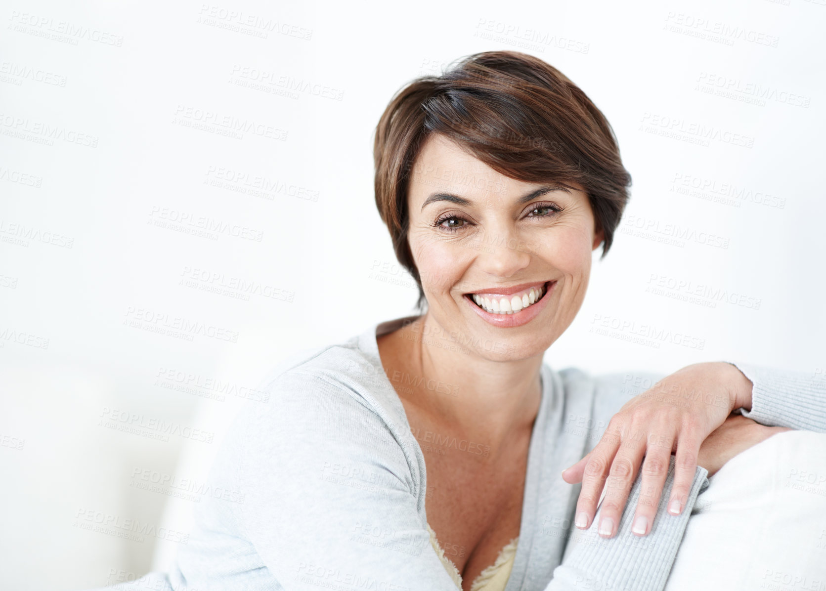 Buy stock photo Peace, portrait and happy woman on sofa for wellness, good mood or positive wellbeing on weekend break. Space, relax or person in living room with smile, day off satisfaction and calm moment at home.