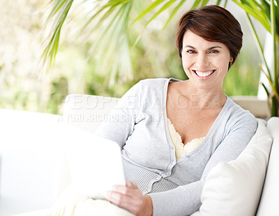 Buy stock photo Tablet, portrait and woman at backyard, smile and relax with internet for newsletter on couch. Tech, outdoor and happy person chilling on weekend break, article and social media post on sofa at patio