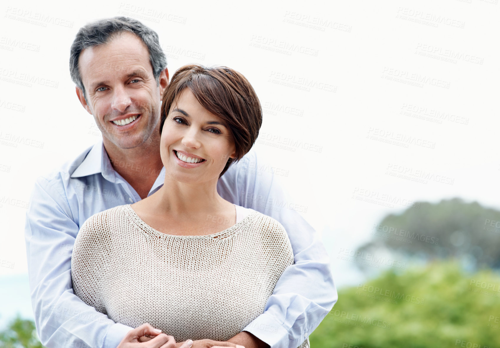 Buy stock photo Smile, hug and couple with love outdoor, loyalty and relationship commitment on vacation. Happy, mature man and woman embrace in nature for care, trust and space on holiday with portrait of partner