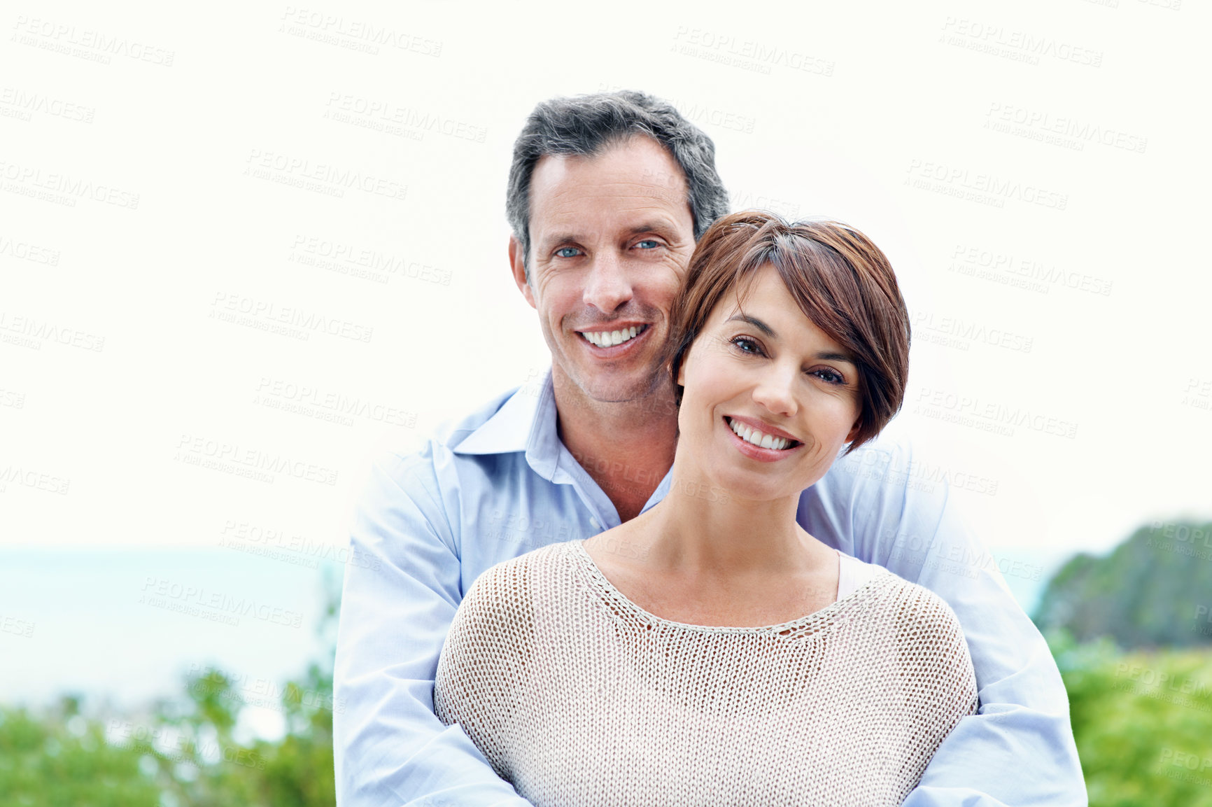 Buy stock photo Portrait, hug and happy couple with love outdoor, loyalty and relationship commitment on vacation. Smile, mature man and woman embrace in nature for support, care and trust on holiday with partner