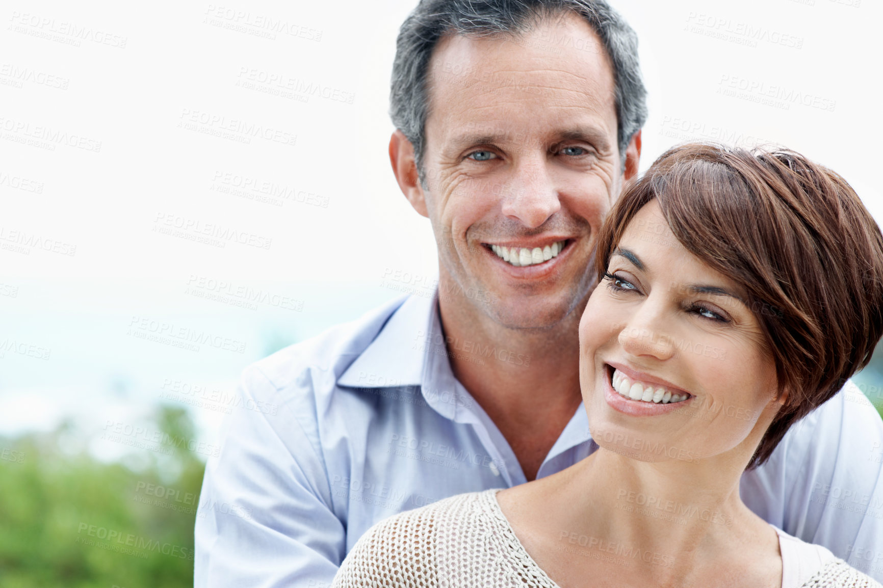 Buy stock photo Smile, couple and hug outdoor with love, care and partner affection for bonding on holiday. Space, people and portrait in nature with mature man, commitment and healthy relationship on vacation trip