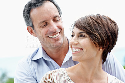 Buy stock photo Smile, couple and love in nature for travel, care and partner affection for bonding on holiday. Happy, mature man or woman embrace with admiration, commitment or healthy relationship on vacation trip