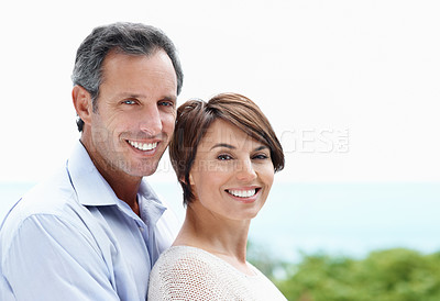 Buy stock photo Smile, portrait and couple with love in nature, loyalty and relationship commitment on vacation. Happy, mature man and woman with connection by ocean for care, trust and space on holiday with partner