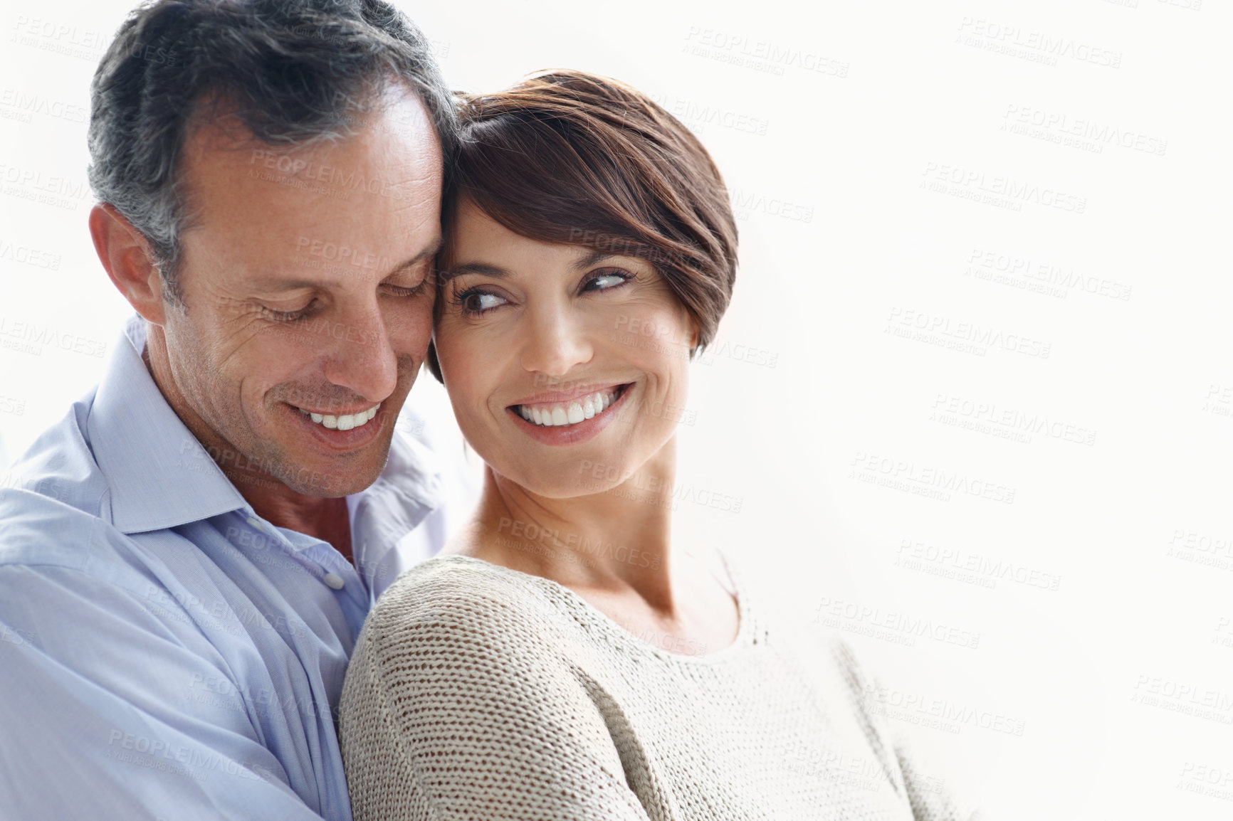 Buy stock photo Happy couple, romance and bonding on break, loyalty or embrace with partner and marriage commitment. White background, mature man and woman with smile, space and connection with spouse in Canada