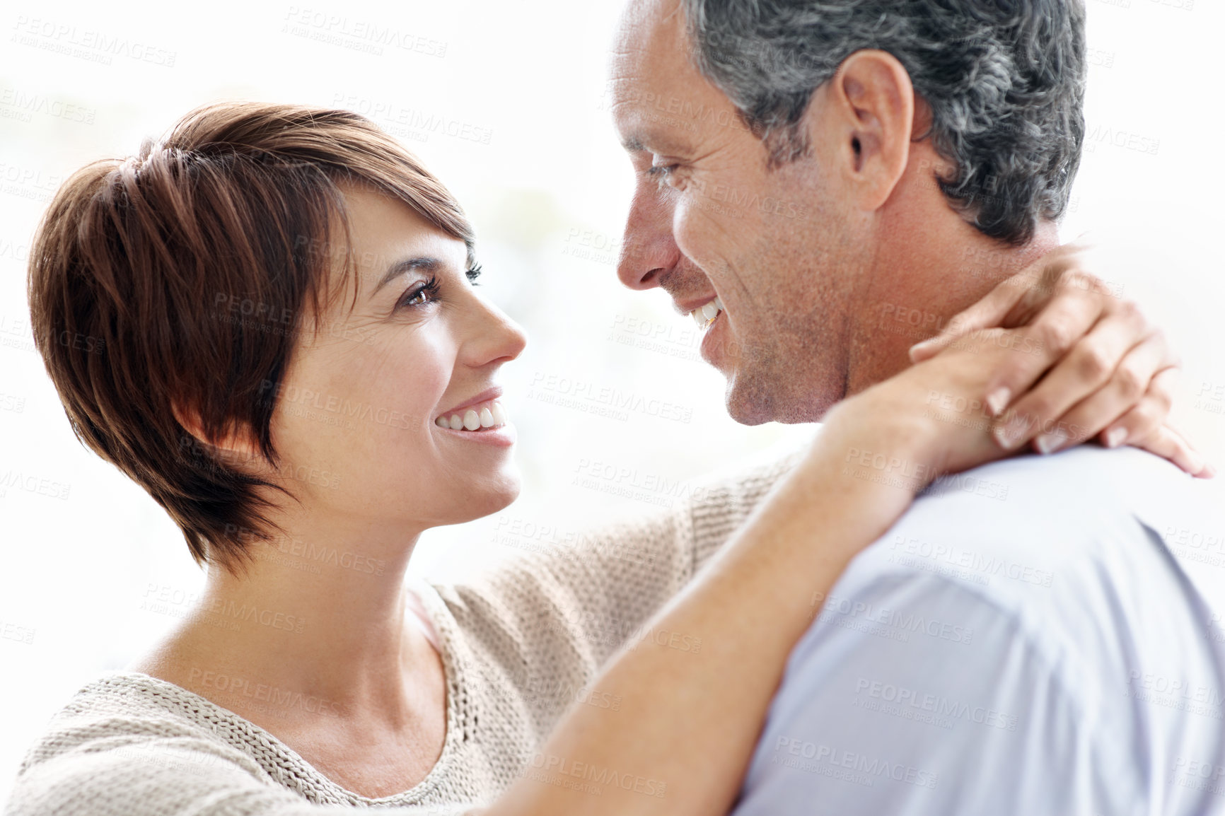 Buy stock photo Smile, hug and couple in home with love, bonding and safety in marriage with affection. Happy, commitment and woman embracing man for care, trust and connection together in relationship in apartment.