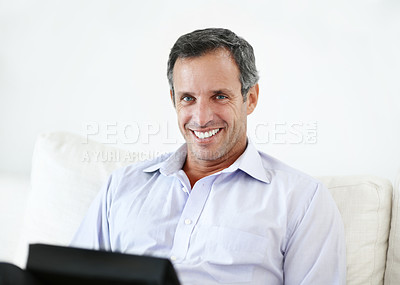 Buy stock photo Smile, remote work and man with tablet on sofa for insurance coverage, pride and confident. Technology, mature person and happy freelancer in home for policy benefits, claims advisor and portrait