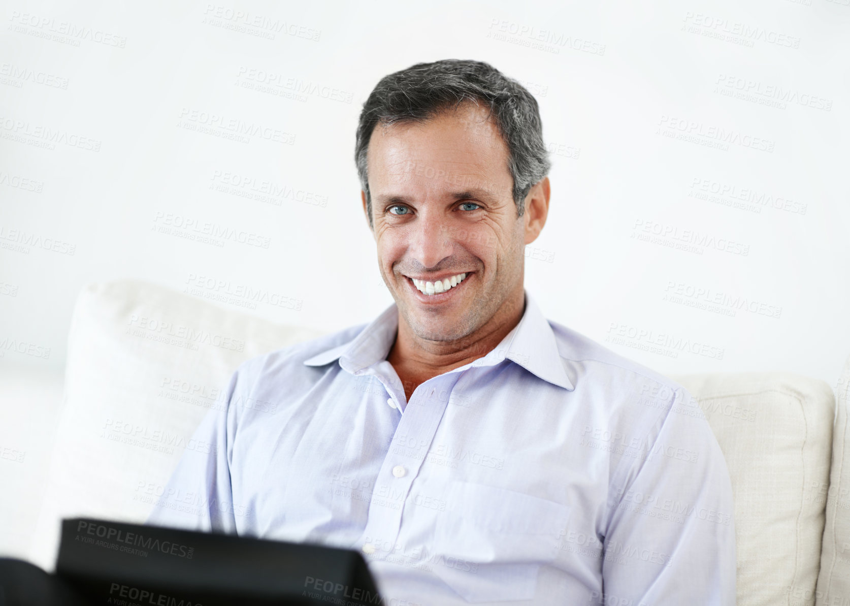 Buy stock photo Smile, remote work and man with tablet on sofa for insurance coverage, pride and confident. Technology, mature person and happy freelancer in home for policy benefits, claims advisor and portrait