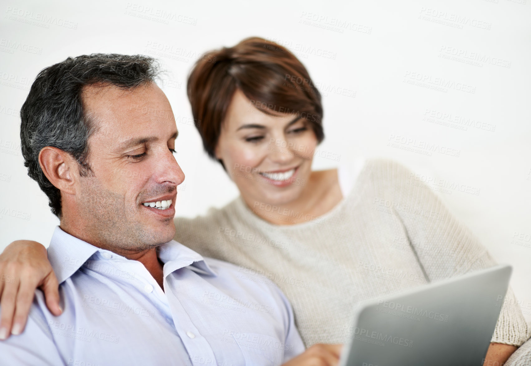 Buy stock photo Happy, man or couple in house with tablet, booking plan or trip decision on travel site. Smile, mature husband or wife in home with tech, vacation review or resort selection on holiday platform.