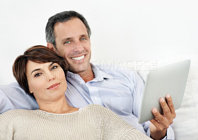 Buy stock photo Portrait, relax or happy couple with tablet on sofa for entertainment or online subscription in home. Man, woman or smile with technology on couch for streaming service or network connection in house
