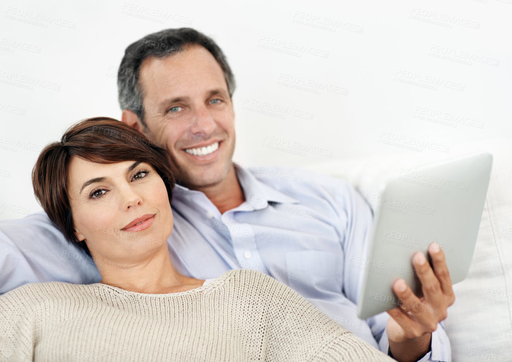 Buy stock photo Portrait, relax or happy couple with tablet on sofa for entertainment or online subscription in home. Man, woman or smile with technology on couch for streaming service or network connection in house