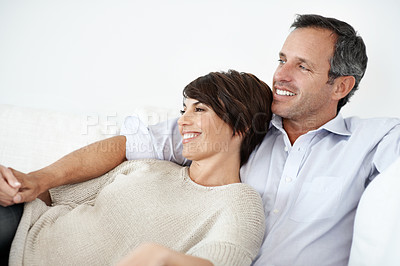 Buy stock photo Relax, sofa and happy couple watching tv in home for online subscription or entertainment together. Man, woman or chilling with smile, comfort or couch for movie, streaming service or series in house