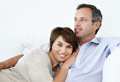 Buy stock photo Relax, smile or couple on sofa with love, partner bonding or cozy cuddle on weekend break. Portrait, mature man or woman in home with space, unwind together or peaceful moment in romantic connection.