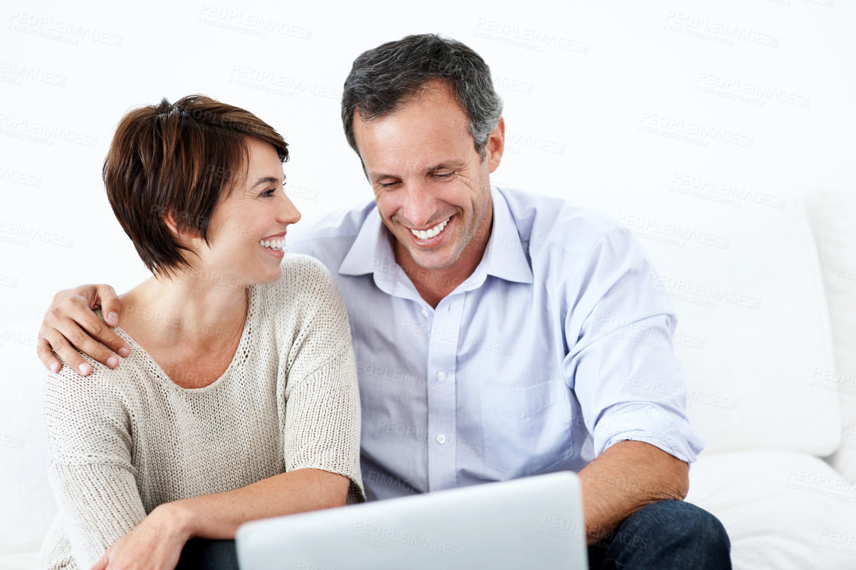 Buy stock photo Happy, couple and browsing in house with laptop, bonding together and website for online shopping. Mature man, woman and internet in lounge with computer, ecommerce and smile for caring relationship.