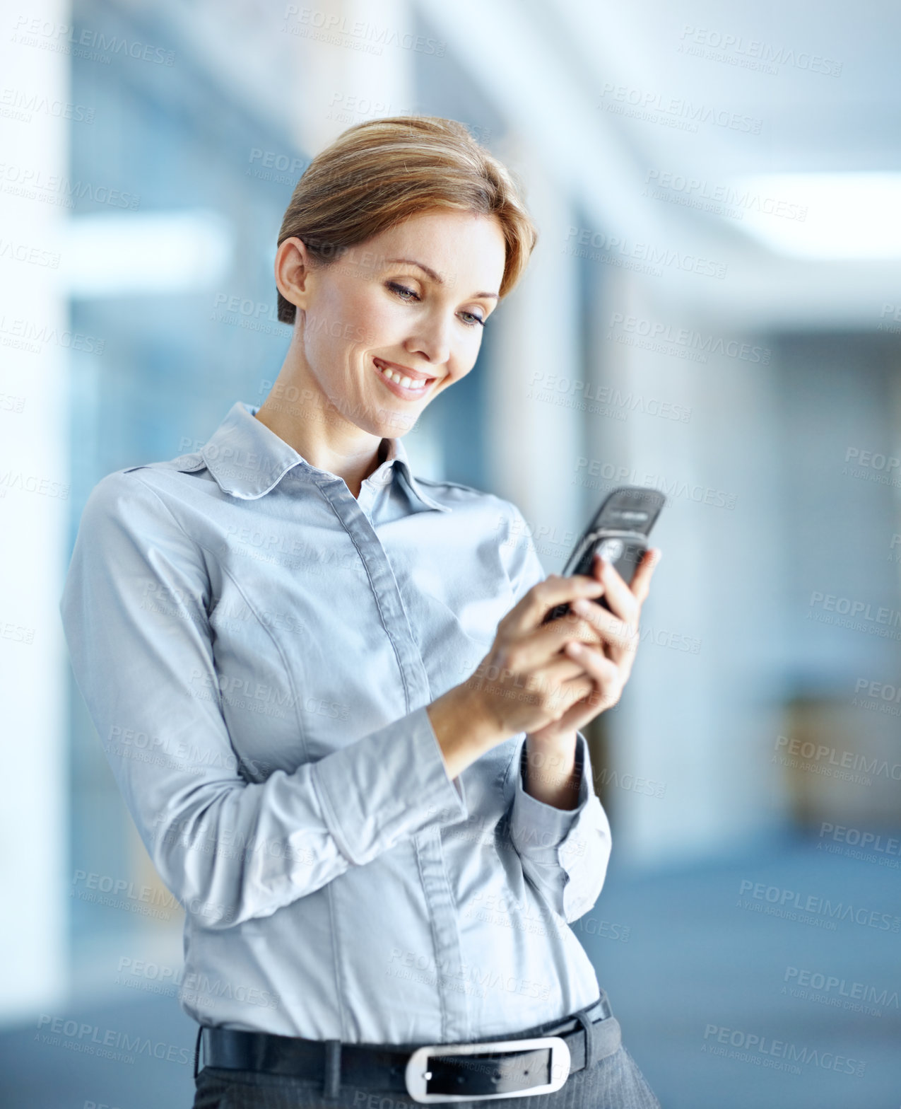 Buy stock photo Businesswoman, smile and typing in office with phone, connectivity and reading public relations update. Happy, person and publicist in workplace with tech, check press release and brand management.