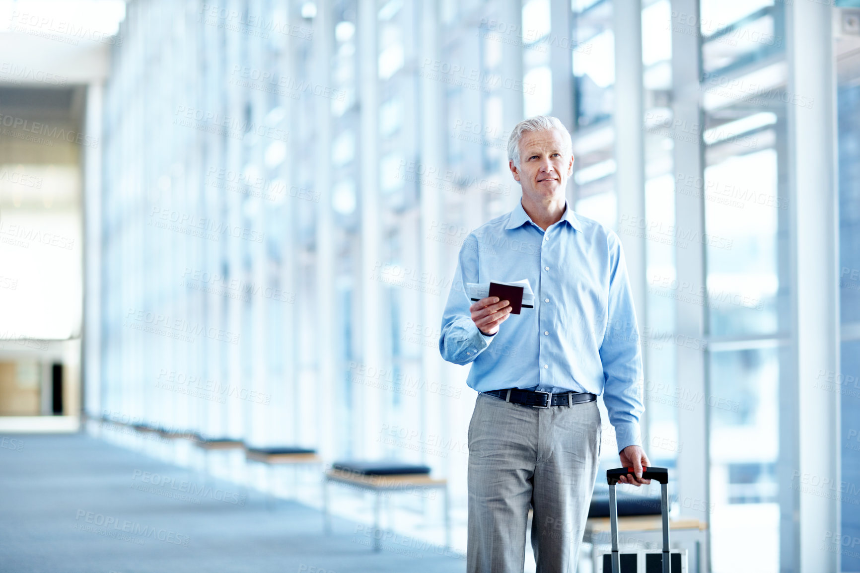 Buy stock photo Airport, space and mature man for business, work trip and suitcase for convention in terminal. Happy, professional and person with ticket, boarding pass and walking for commute, travel and conference