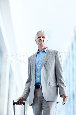 Buy stock photo Suitcase, business and mature man for travel, international trip and thoughtful for convention in airport. Corporate, thinking and low angle of person with luggage for conference, commute and walking