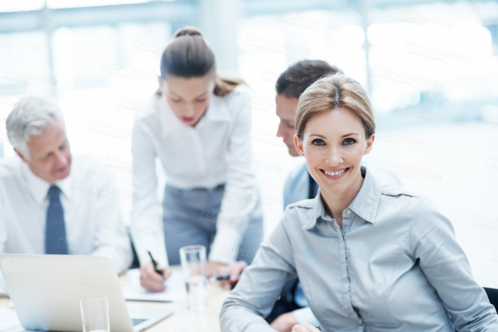Buy stock photo Team, leadership and businesswoman with smile in meeting, risk assessment or research with paperwork. Business people, discussion and confident with project, portrait and collaboration with documents