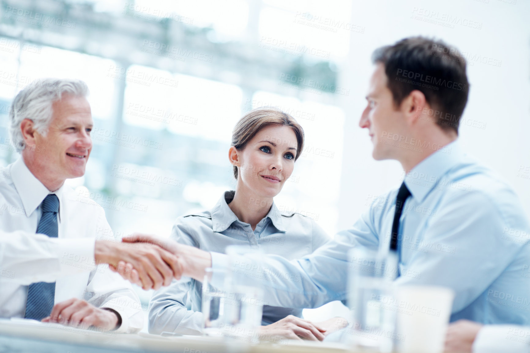 Buy stock photo Shaking hands, meeting and business people in office for partnership, deal or legal settlement. Team, happy and attorneys with general counsel for handshake on court case, law or mediation process.