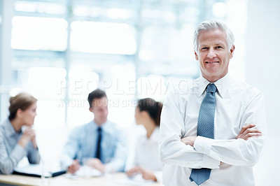 Buy stock photo Leader, meeting and businessman with arms crossed in office, wealth management or career development. Happy, portrait and mature person with colleagues, investment banking and business growth in USA