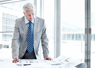 Buy stock photo Businessman, reading and documents in office with budget report, brainstorming and finance management. Mature person, accounting and paperwork in workplace with review, financial planning or thinking