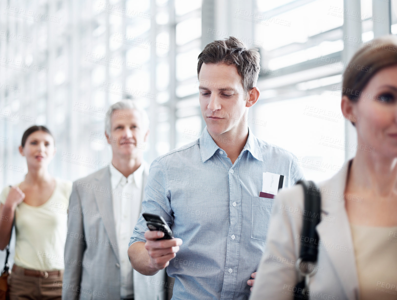 Buy stock photo Travel, phone or businessman in line at airport for checkin, work journey or check flight schedule. People, passenger and mobile app in queue for security checkpoint, boarding time and business trip