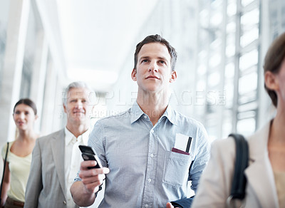 Buy stock photo Airport, walking and business man with phone for work trip, commute and travel for global convention. Low angle, cellphone and people in lobby with boarding info for departure, journey and conference