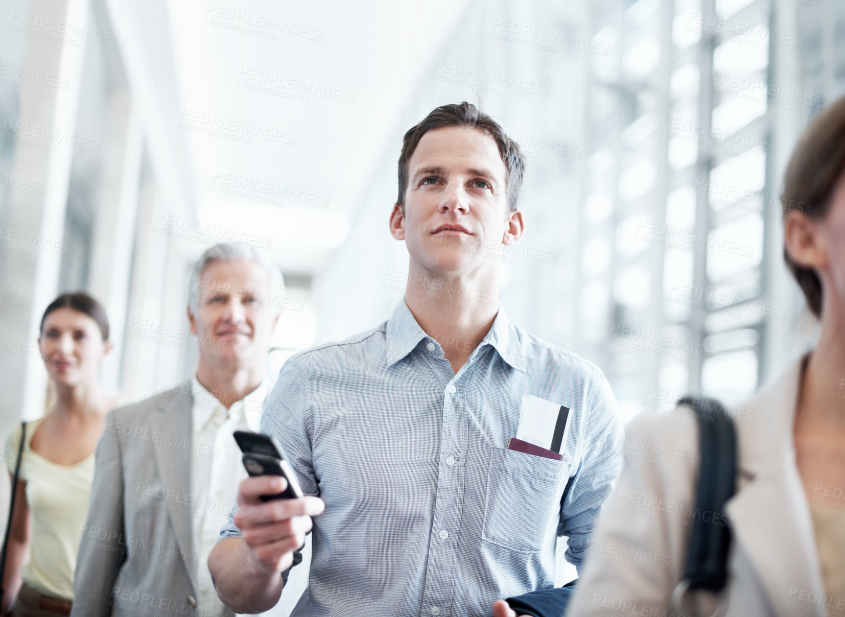 Buy stock photo Airport, walking and business man with phone for work trip, commute and travel for global convention. Low angle, cellphone and people in lobby with boarding info for departure, journey and conference