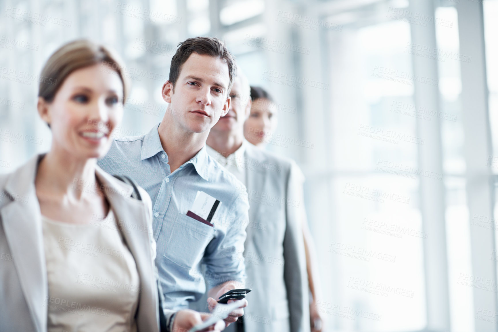Buy stock photo Travel, phone and man in queue at airport for ticket checkin, check departure time and work journey. People, passenger portrait and mobile app in line for security checkpoint, business trip or flight