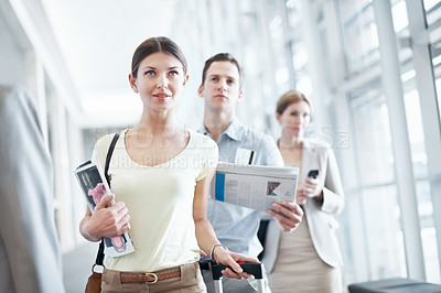 Buy stock photo Woman, airport and waiting line for travel delay, business trip and global journey with luggage. People, international flight or group in queue with magazine, suitcase or immigration with passenger