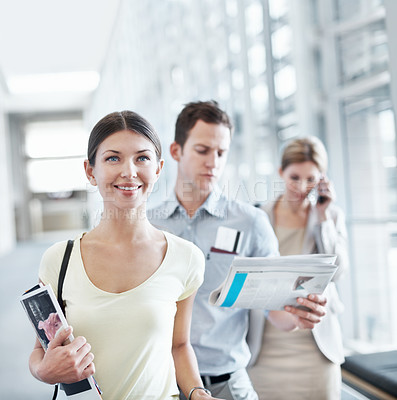 Buy stock photo Happy, woman and wait in airport with travel holiday, magazine or queue for boarding overseas flight. Person, smile and people line up in terminal for international vacation, trip and departure.
