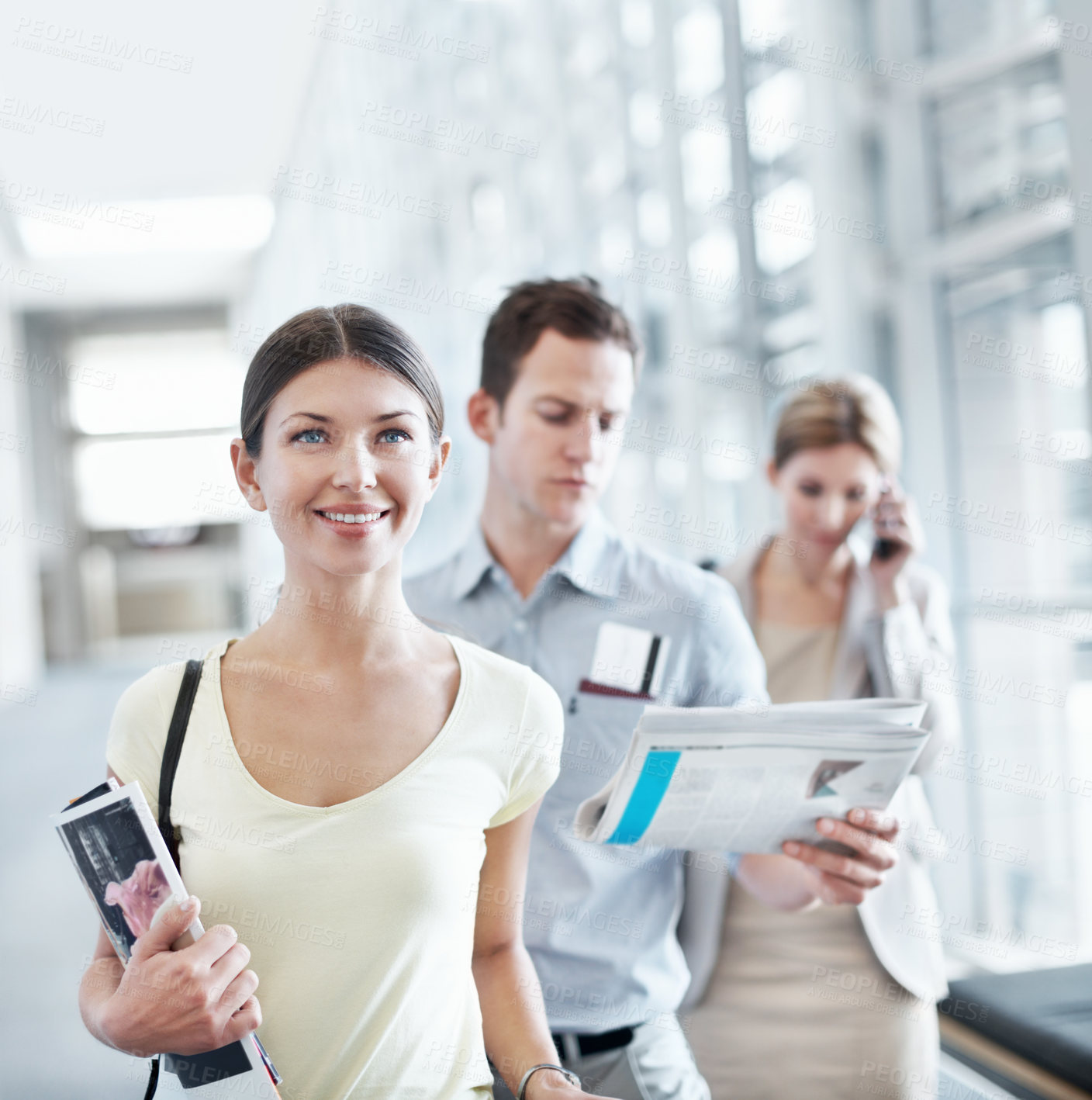 Buy stock photo Happy, woman and wait in airport with travel holiday, magazine or queue for boarding overseas flight. Person, smile and people line up in terminal for international vacation, trip and departure.