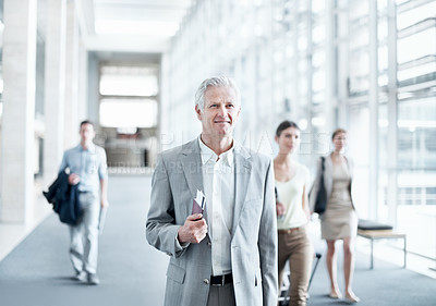 Buy stock photo Happy, walking or businessman at airport with trip, journey or commute to b2b seminar. Boarding, smile or mature employee with document, company travel or flight departure for corporate conference.