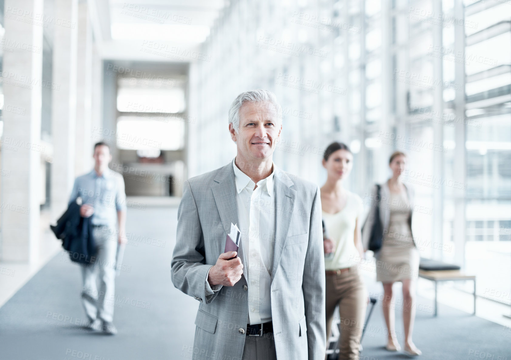 Buy stock photo Happy, walking or businessman at airport with trip, journey or commute to b2b seminar. Boarding, smile or mature employee with document, company travel or flight departure for corporate conference.