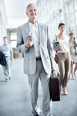 Buy stock photo Happy, luggage or businessman at airport with trip, journey or commute to b2b seminar. Boarding, smile or mature employee with baggage, company travel or flight departure for corporate conference.
