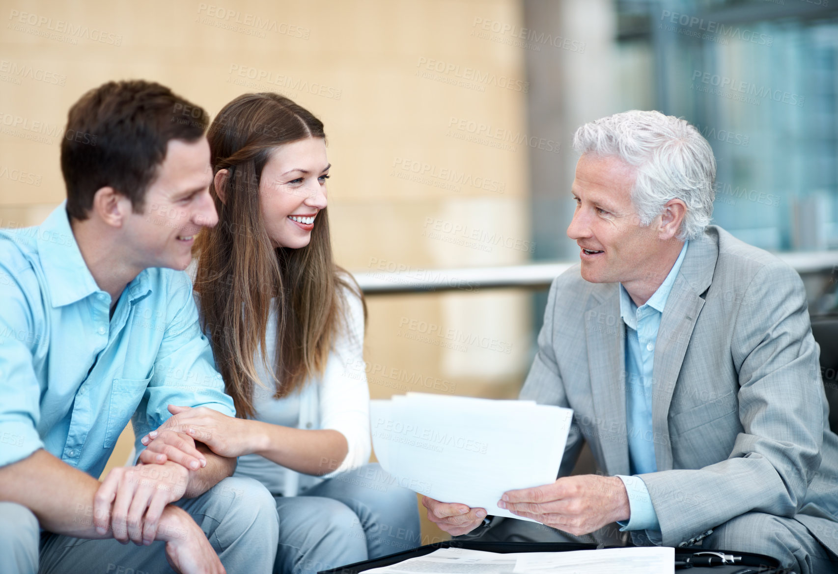 Buy stock photo Businessman, documents or lawyer with couple in office for legal advice, contract or guidance. Man, woman or discussion with attorney for asset management, tax avoidance or assistance in workplace