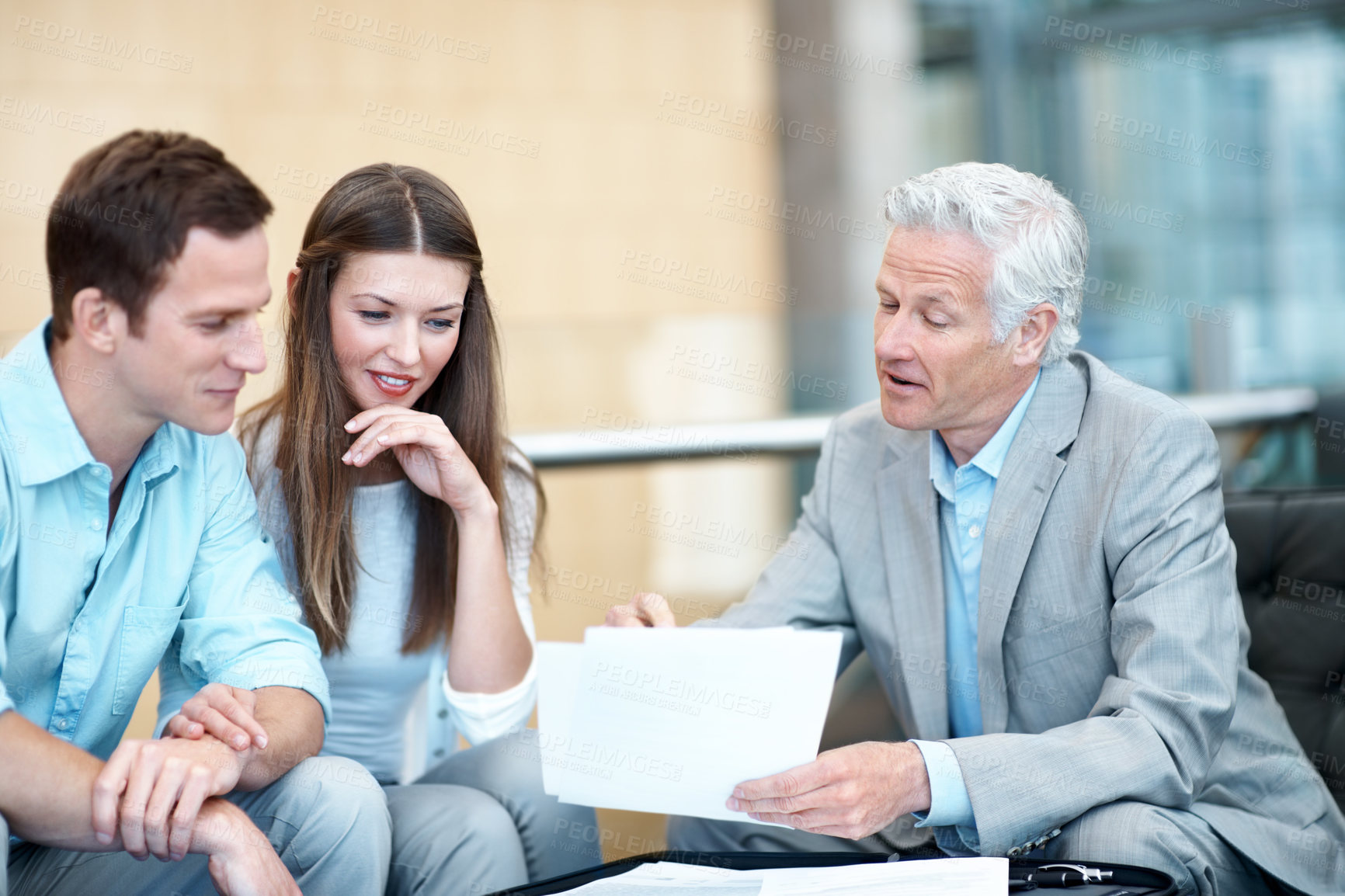 Buy stock photo Couple, meeting and lawyer in office with document, contract and finance report for funding. Smile, people and attorney in workplace with paperwork, review budget and loan application for investment