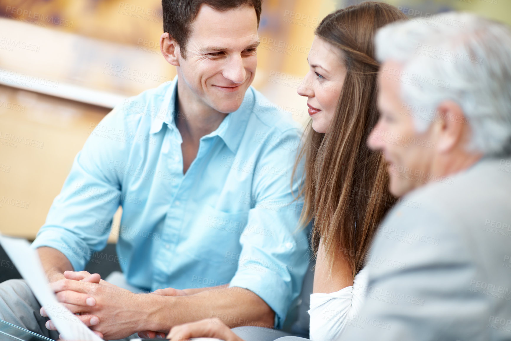Buy stock photo Smile, documents and lawyer with couple in office for prenup agreement, meeting and advice. Marriage contract, legal advisor with man and woman in law firm for deal, estate planning and proposal