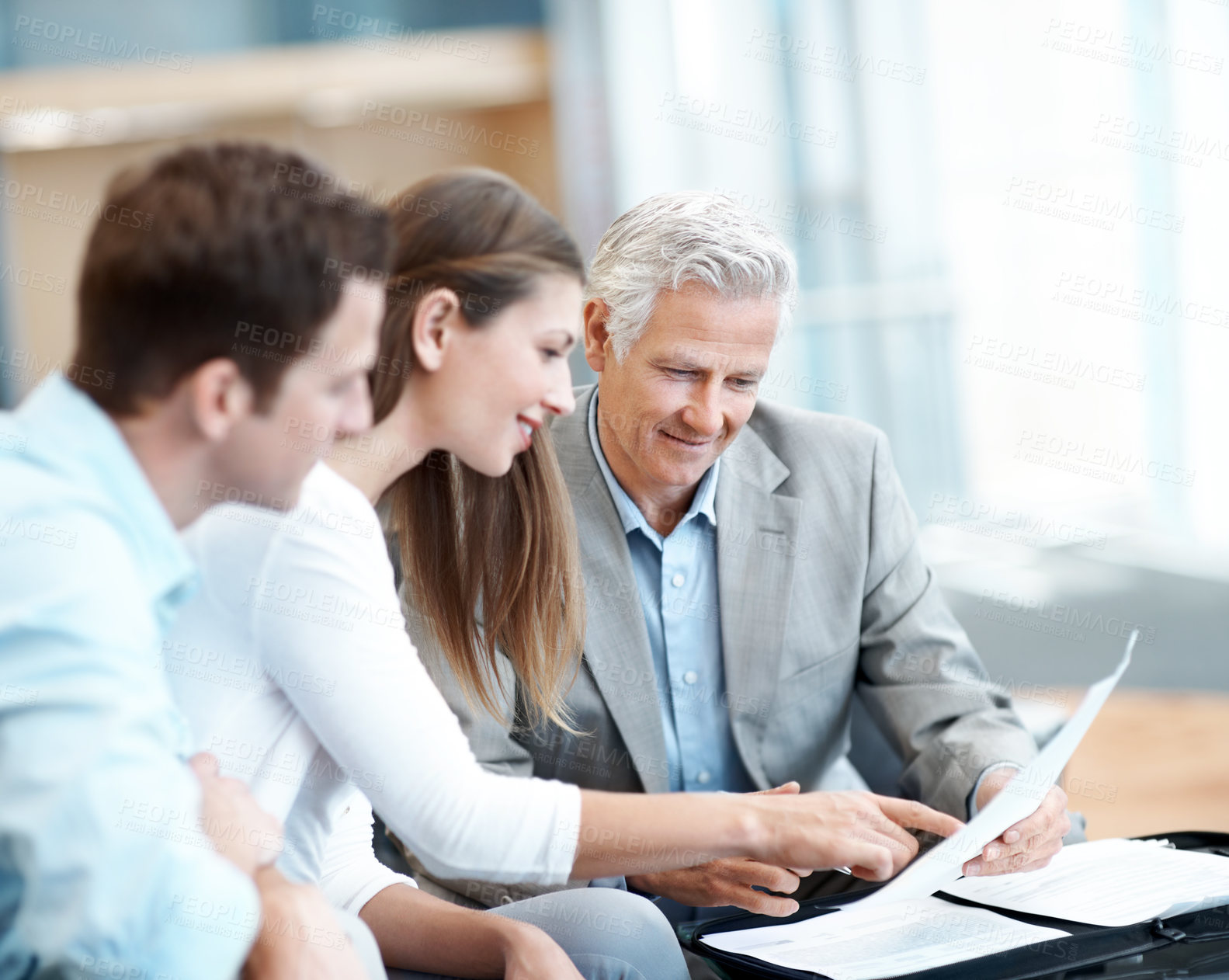 Buy stock photo Businessman, documents or finance advice with couple in office for investment or budget planning. Man, woman or discussion with financial advisor for asset management, tax or expenses in workplace